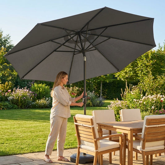 Double sided parasol with black, white, and grey canopy for outdoor use