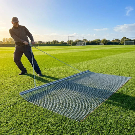 Steel drag mat on a sports field, showcasing its robust design for field maintenance - product detail