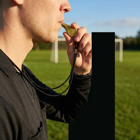 Brass referee whistle with lanyard, ideal for sports and events - product detail