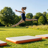 Inflatable Gymnastics Block in orange, grey, and black