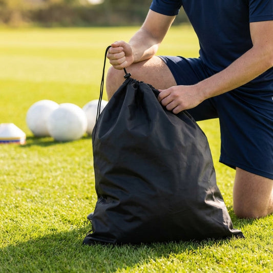 Football kit bag with durable PVC exterior, ideal for sports equipment transport