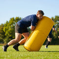 Rugby tackle bag in black and yellow, made from weatherproof PVC