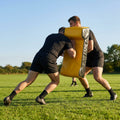 Curved rugby tackle shield for effective training