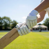 Junior cricket batting gloves with leather palm and mesh ventilation