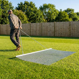 Steel drag mat on a sports field, showcasing its robust design for field maintenance