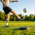 Football return trainer with elastic cord for skill development
