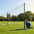 Pitch divider net system with galvanised steel posts and tensioned net