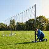 Pitch divider net system with galvanised steel posts and tensioned net