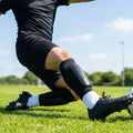 Black shin pads with compression sleeves for football players - product detail