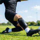 Black shin pads with compression sleeves for football players - product detail