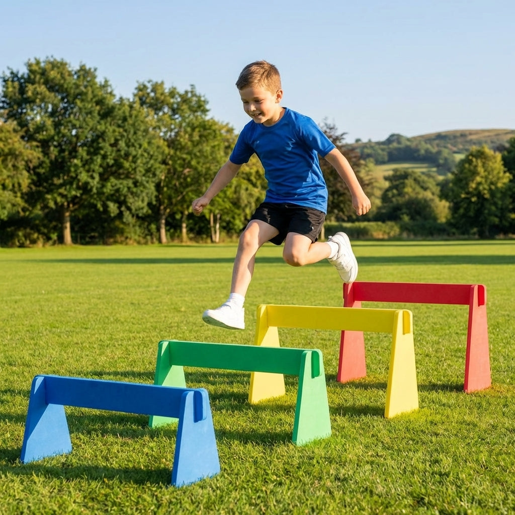 Adjustable foam hurdles in red, yellow, green, and blue for young athletes