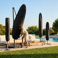 Black weatherproof parasol cover for garden storage