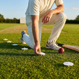 White Bowler Run-Up Marking Discs on Cricket Field