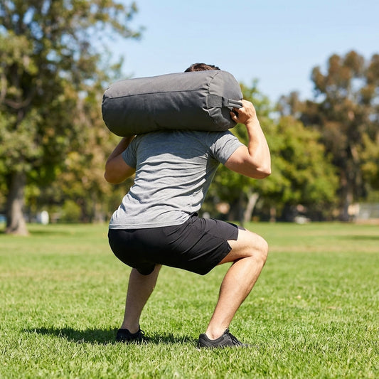Black fitness sandbag 20kg, durable polyethylene, home gym equipment