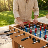 Assorted table football spare parts including player rods and aprons