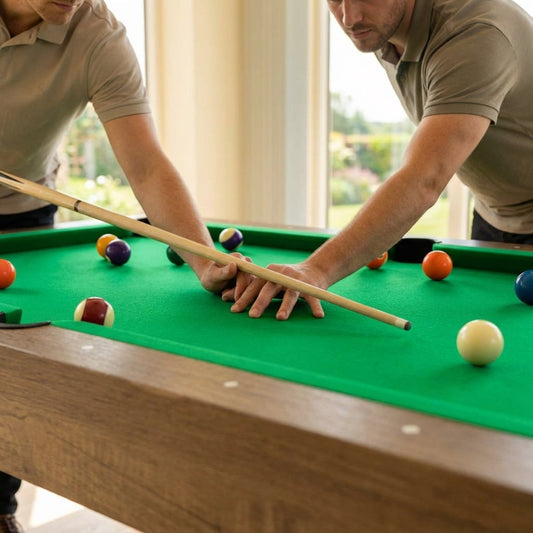 Game table accessories including pool cues, air hockey pucks, and table tennis net
