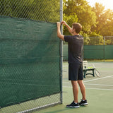 Green Tennis Court Windbreaks on an outdoor tennis court