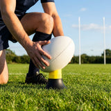 Adjustable rugby kicking tee in bright colour made from durable plastic