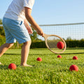 Yellow foam mini tennis balls on a tennis court