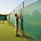 Green Tennis Court Windbreaks on an outdoor tennis court
