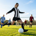 Women's football kit with long-sleeved striped shirt, shorts, and knee-high socks