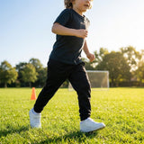 Black junior tracksuit bottoms made from 100% polyester for sportswear