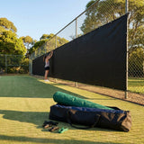 Green Tennis Court Windbreaks on an outdoor tennis court