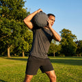 Black fitness sandbag 20kg, durable polyethylene, home gym equipment