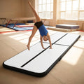 Inflatable gymnastics mat in orange and grey designed for home and gym use