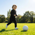 Black junior tracksuit bottoms made from 100% polyester for sportswear
