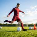 Men's football kit in various colours, including long-sleeve shirt, shorts, and socks
