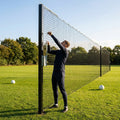 Pitch divider net system with galvanised steel posts and tensioned net