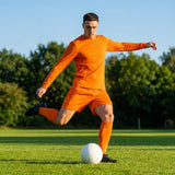 Men's football kit in various colours, including long-sleeve shirt, shorts, and socks