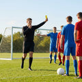 Football referee kit with fluro yellow or black shirt, shorts, and socks