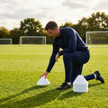 Set of vibrant football training cones in various sizes and colours