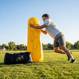 High-visibility American football training dummies in yellow PVC