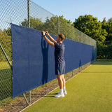 Green Tennis Court Windbreaks on an outdoor tennis court