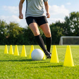 Set of vibrant football training cones in various sizes and colours