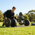 Black Olympic bumper plates made from Virgin rubber