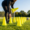 Set of vibrant football training cones in various sizes and colours