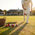 Cricket training ball with reverse swing capability, in red/white and pink/white