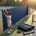Green Tennis Court Windbreaks on an outdoor tennis court