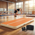 Inflatable gymnastics mat in orange and grey designed for home and gym use
