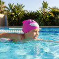 Kids swimming cap with fish design in blue and pink, made from silicone