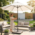Double-sided garden parasol providing outdoor shade with steel frame