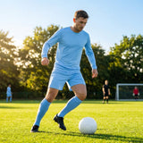 Men's football kit in various colours, including long-sleeve shirt, shorts, and socks