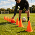 Set of vibrant football training cones in various sizes and colours