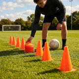 Set of vibrant football training cones in various sizes and colours