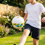 Lightweight garden football with traditional white design and colourful patterns