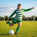 Women's football kit with long-sleeved striped shirt, shorts, and knee-high socks